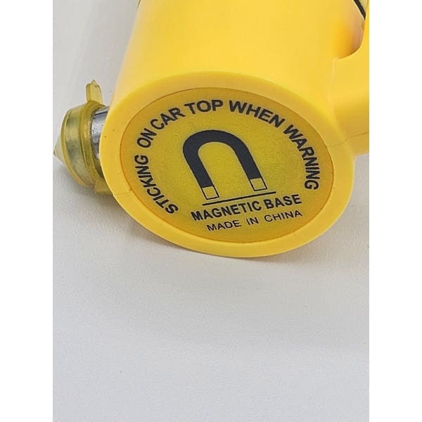 Close-up of a yellow bottle cap with caution text.
