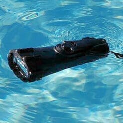 Black Vortex Flashlight Floating in Pool